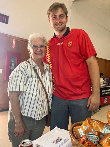 Jack Richardson with a resident at a community lunch