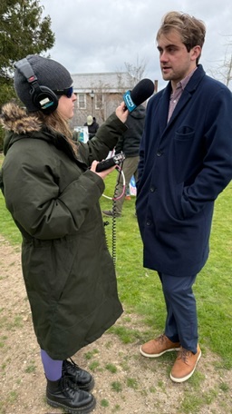 Jack Richardson being interviewed by a reporter at an outdoor event