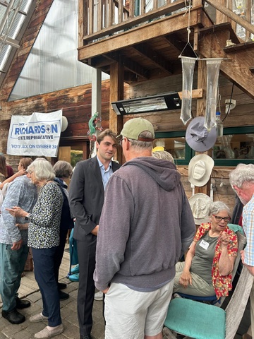 Jack Richardson talking with residents at a campaign event