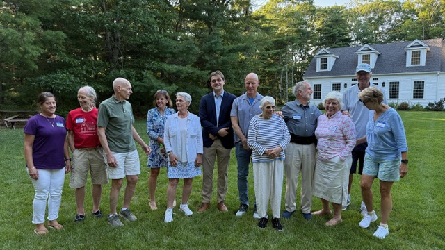 Jack Richardson with a group of supporters at a Cape Cod house party